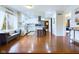 Spacious kitchen with island, stainless appliances, modern white cabinets, and hardwood floors at 1634 Muessing Rd, Indianapolis, IN 46239