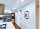 Galley kitchen featuring stainless steel appliances and a barn door entrance at 1634 Muessing Rd, Indianapolis, IN 46239