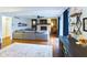 Cozy living room with fireplace, hardwood floors, large sectional, and decor shelving at 1634 Muessing Rd, Indianapolis, IN 46239