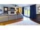 Spacious living room with a fireplace, a comfy sectional, and a glass patio door at 1634 Muessing Rd, Indianapolis, IN 46239
