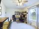 Bright office space with a large window, built-in shelving, and modern desk setup at 1634 Muessing Rd, Indianapolis, IN 46239