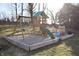 Backyard playground with swings, slide, and playhouse at 1634 Muessing Rd, Indianapolis, IN 46239