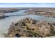 Exceptional aerial view displays an expansive lakeside property with bridge access and picturesque scenery at 18 Point Ln, Arcadia, IN 46030