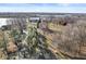 Expansive aerial shot displaying well-maintained grounds with mature trees, landscaping and a private driveway at 18 Point Ln, Arcadia, IN 46030