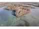 Wide aerial view of lakefront property and frozen lake at 18 Point Ln, Arcadia, IN 46030
