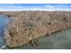 Aerial view of lakefront home with private dock on the water at 18 Point Ln, Arcadia, IN 46030