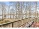 Inviting deck view with mature trees and potential lake views, ready for outdoor enjoyment at 18 Point Ln, Arcadia, IN 46030