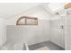 Bright bathroom with tiled walls, a rainfall shower, and a small window at 18 Point Ln, Arcadia, IN 46030