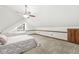Attic bedroom includes a window nook, carpeted floor, and access to closet storage at 18 Point Ln, Arcadia, IN 46030