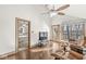 Bonus room includes a ceiling fan, wood floors, and access to another room and the balcony at 18 Point Ln, Arcadia, IN 46030