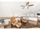Open concept bonus room featuring comfortable chairs, wood floors, and a ceiling fan at 18 Point Ln, Arcadia, IN 46030