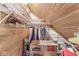 Attic closet offering ample storage space with wood paneling and organized shelving at 18 Point Ln, Arcadia, IN 46030