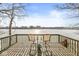 Charming deck featuring scenic waterfront view with seating at 18 Point Ln, Arcadia, IN 46030