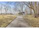 Long driveway leading up to a home surrounded by mature trees and a sprawling lawn at 18 Point Ln, Arcadia, IN 46030