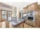 Spacious kitchen with large island, granite countertops, and stainless steel appliances at 18 Point Ln, Arcadia, IN 46030
