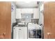 Functional laundry room with washer, dryer, and ample storage at 18 Point Ln, Arcadia, IN 46030