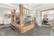 Spacious living room with fireplace and glass block wall connects to other rooms at 18 Point Ln, Arcadia, IN 46030