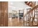 Spacious living room showcasing hardwood floors, fireplace and spiral staircase at 18 Point Ln, Arcadia, IN 46030