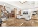 Bright and airy living room with hardwood floors and spiral staircase showcases modern design at 18 Point Ln, Arcadia, IN 46030