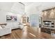 Bright, open living room with high ceilings, glass block accent, and modern finishes at 18 Point Ln, Arcadia, IN 46030