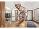 Dramatic spiral staircase with hardwood floors, an open layout, and natural light at 18 Point Ln, Arcadia, IN 46030