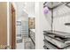View into a closet with custom shelving and wire storage baskets in an ensuite bathroom at 18 Point Ln, Arcadia, IN 46030