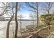Scenic view of the waterfront with a private dock and charming deck area at 18 Point Ln, Arcadia, IN 46030