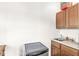 Wet bar area with cabinets, sink, and mini fridge is perfect for entertaining at 18 Point Ln, Arcadia, IN 46030
