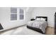 Inviting bedroom with a large window, plush bedding, and stylish neutral decor at 1935 Ponsonby Dr, Westfield, IN 46074