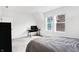 Bright bedroom features a modern desk, plush bedding, and large windows at 1935 Ponsonby Dr, Westfield, IN 46074