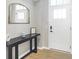 Inviting entryway featuring a stylish console table and a bright white front door with glass inserts at 1935 Ponsonby Dr, Westfield, IN 46074