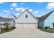 Spacious two-car garage with a wide driveway, offering ample parking and storage space at 1935 Ponsonby Dr, Westfield, IN 46074