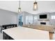 Open kitchen featuring a center island with bar stools and views into the living room, perfect for entertaining at 1935 Ponsonby Dr, Westfield, IN 46074
