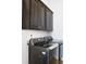 Well-equipped laundry room with modern washer and dryer, and ample storage cabinets at 1935 Ponsonby Dr, Westfield, IN 46074