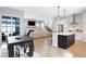 Open-concept living area featuring a modern kitchen, dining space, and a cozy fireplace at 1935 Ponsonby Dr, Westfield, IN 46074