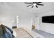 Spacious main bedroom showcasing a walk-in shower, television, and neutral decor at 1935 Ponsonby Dr, Westfield, IN 46074