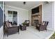 Relaxing outdoor living space with a fireplace, TV, and plush seating at 1935 Ponsonby Dr, Westfield, IN 46074