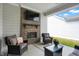 Comfortable outdoor living space with a fireplace, TV, and cozy seating area at 1935 Ponsonby Dr, Westfield, IN 46074
