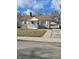Charming single-story home features stone accents, a covered porch, and a detached garage at 2006 Medford Ave, Indianapolis, IN 46222