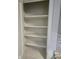 View of the empty, well-lit pantry with several shelves for optimal storage space at 2006 Medford Ave, Indianapolis, IN 46222