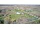 Aerial view of property with several structures and surrounding greenery at 2141 E County Road 200 N, Danville, IN 46122