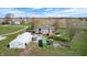 Overhead view of a home and outbuildings on a large lot, with green grass at 2141 E County Road 200 N, Danville, IN 46122