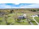 Scenic aerial view of the property with its circular driveway, surrounded by lush greenery and mature trees at 2141 E County Road 200 N, Danville, IN 46122