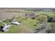 Drone shot showcasing the residential property with lush green lawns, outbuildings, and ample parking at 2141 E County Road 200 N, Danville, IN 46122