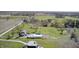 Beautiful aerial shot of the property, featuring a home, outbuildings, expansive fields, and mature trees at 2141 E County Road 200 N, Danville, IN 46122