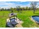 Sprawling backyard with in-ground hot tub, above ground pool, mature trees and landscaping at 2141 E County Road 200 N, Danville, IN 46122