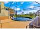 View of backyard with wooden deck, above ground pool, and surrounding trees at 2141 E County Road 200 N, Danville, IN 46122