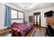 Cozy bedroom featuring hardwood floors, with dark wood trim, and ceiling fan at 2141 E County Road 200 N, Danville, IN 46122