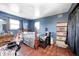 A bedroom featuring a wooden bed frame and wood floors at 2141 E County Road 200 N, Danville, IN 46122