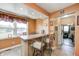 Sunny breakfast nook features a window overlooking the yard and a bar area with seating for casual dining at 2141 E County Road 200 N, Danville, IN 46122